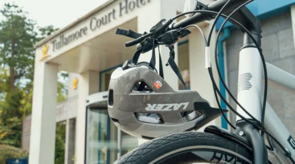 A bicycle with helmet outside Tullamore Court Hotel entrance.