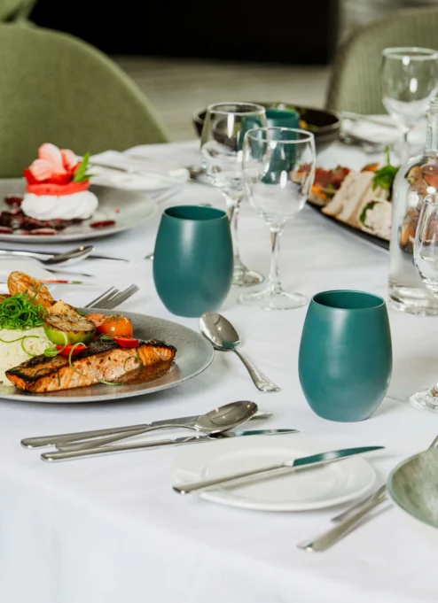 Elegant dining table with gourmet meals in a cosy, inviting restaurant setting.