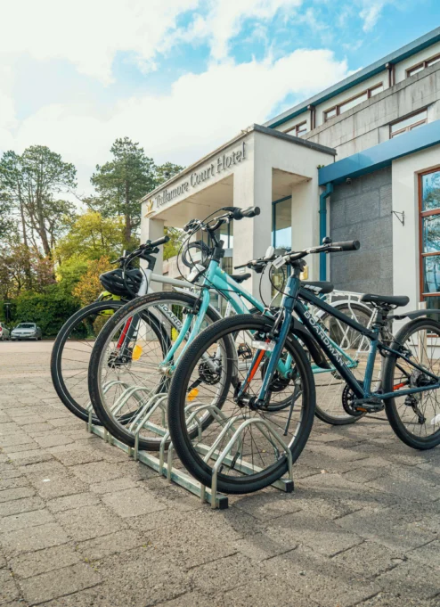 Bicycles parked outside a charming hotel, ready for family adventures.