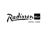 A welcoming family enjoys a luxurious stay at a resort. Visible text reads "Radisson Blu".