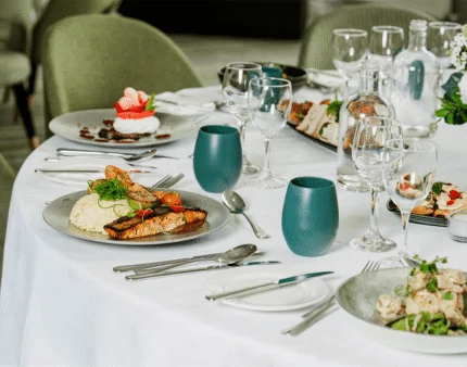Elegant dining table set with gourmet dishes at a welcoming hotel restaurant.