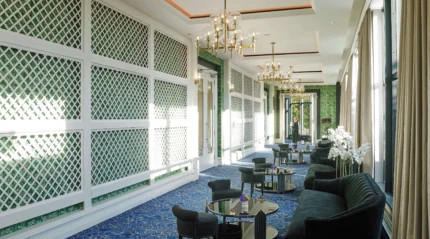 Elegant hotel lounge with cosy seating and natural light.