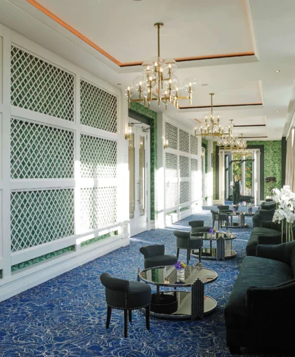 Elegant hotel lounge with cosy seating and natural light.