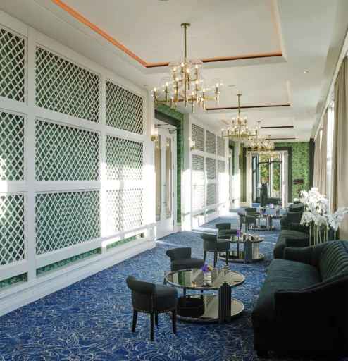 Elegant hotel lounge with cosy seating and natural light.