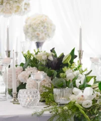 Elegant table setting with floral centrepiece at a bright, inviting event space.