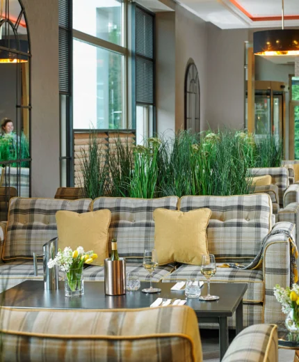 Cosy hotel lounge with plush seating and a welcoming atmosphere.