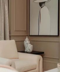 Elegant hotel lounge with cosy seating and chic artwork.
