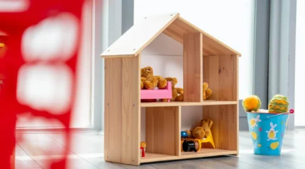 A cosy playroom with toys and a wooden dollhouse at Tullamore Court Hotel.