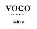A couple enjoys a luxurious hotel experience, showcasing hospitality at Voco Hotel Belfast.